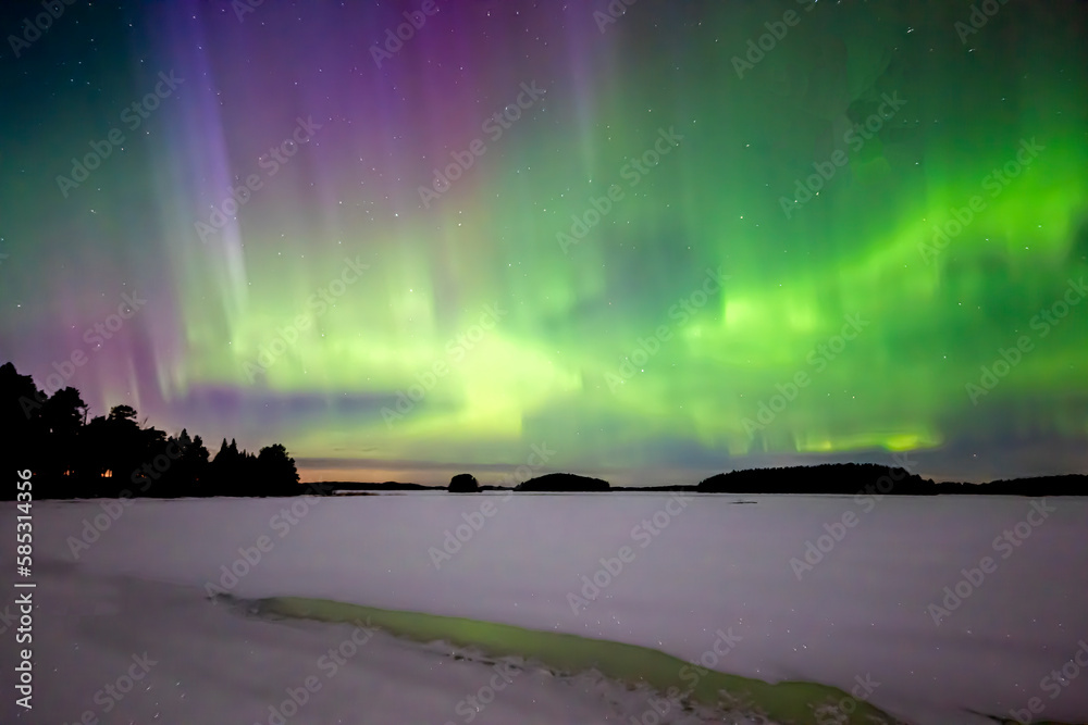 Northern lights dancing over frozen lake in north of Sweden. Farnebofjarden natinalpark.