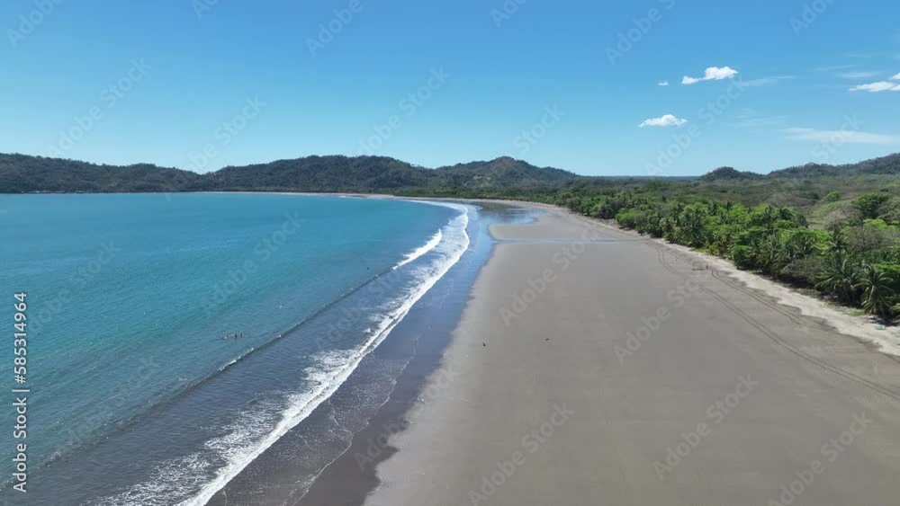 A pristine tropical beach in Costa Rica, with palm trees swaying in the breeze, crystal clear water, soft white sand, and vibrant wildlife in the surrounding rainforest. A pristine tropical beach in Costa Rica, with palm trees swaying in the breeze, crystal clear water, soft white sand, and vibrant wildlife in the surrounding rainforest.