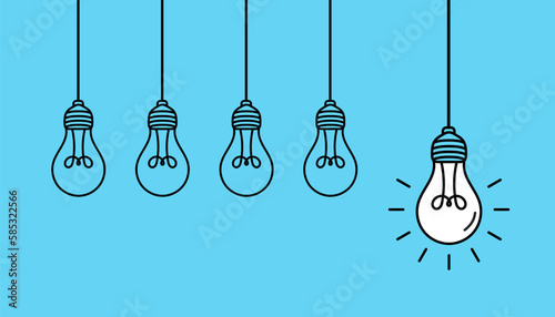 Hanging light bulbs with one glowing on blue background. Concept of idea