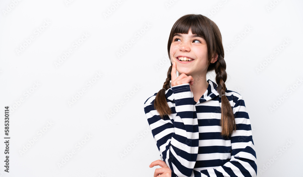 Little caucasian girl isolated on white background thinking an idea while looking up Little caucasian girl isolated on white background thinking an idea while looking up