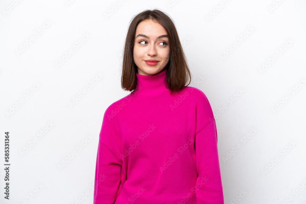 Young Ukrainian woman isolated on white background making doubts gesture looking side Young Ukrainian woman isolated on white background making doubts gesture looking side
