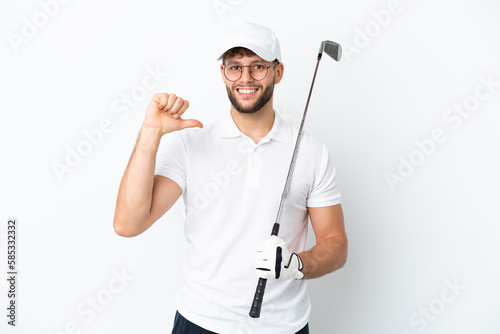 Handsome young man playing golf isolated on white background proud and self-satisfied