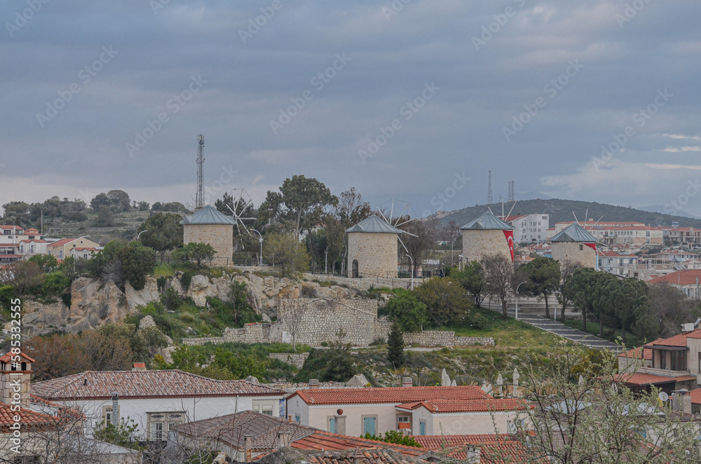 old windmills on the hill in Alacati town center (cesme, Izmir region, Turkey)