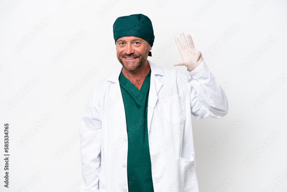 Middle age surgeon in green uniform isolated on white background happy and counting four with fingers Middle age surgeon in green uniform isolated on white background happy and counting four with fingers