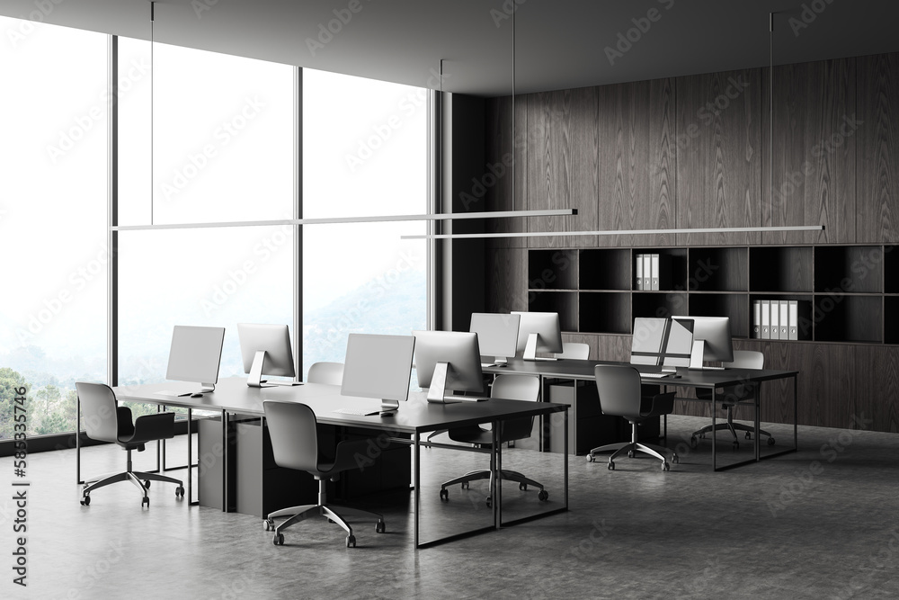 Grey office interior with pc computer and shelf near panoramic window Grey office interior with pc computer and shelf near panoramic window