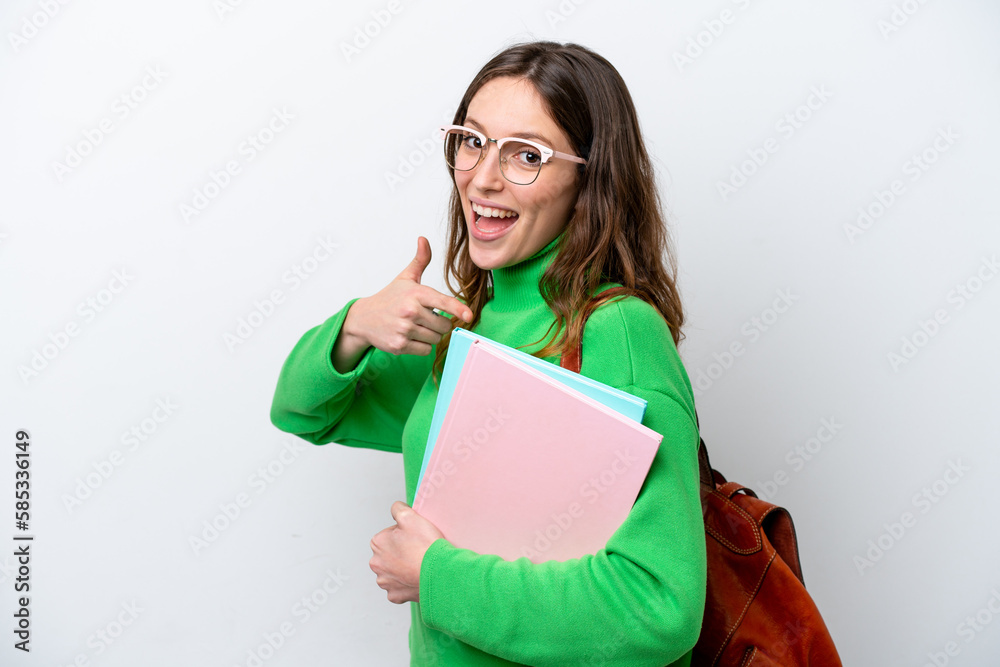 Young student caucasian woman isolated on white background and pointing it Young student caucasian woman isolated on white background and pointing it
