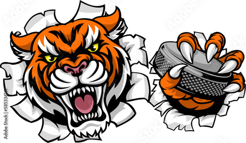 A tiger ice hockey player animal sports mascot holding a puck