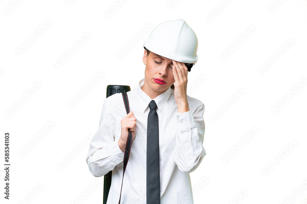 Young architect woman with helmet and holding blueprints over isolated background with headache Young architect woman with helmet and holding blueprints over isolated background with headache