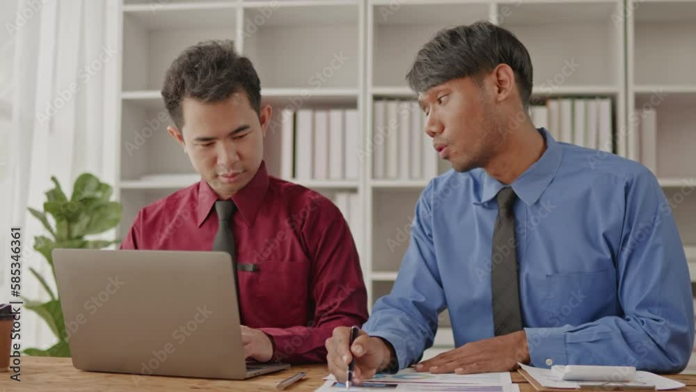 Businessman teamwork are working and brainstorming calculate on paperworks and laptop that shows chat and graph of of accounting static financial cost and marketing. Businessman teamwork are working and brainstorming calculate on paperworks and laptop that shows chat and graph of of accounting static financial cost and marketing.