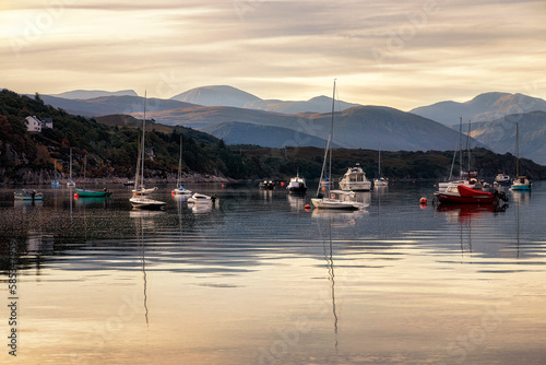 Boats at anchor at dawn in Ullapool, Highlands, Scotland photo