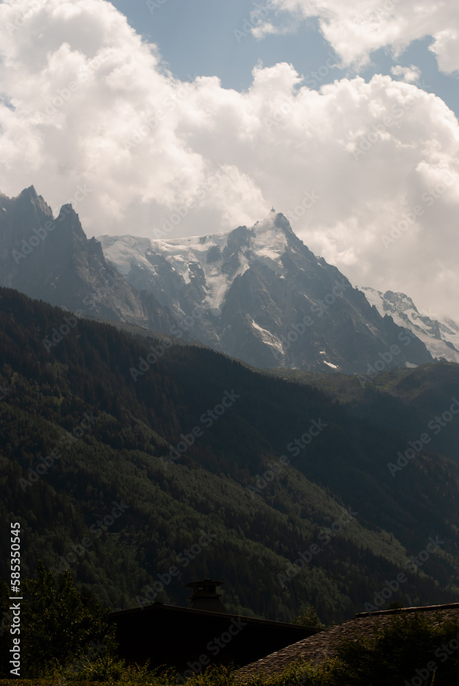White clouds over mountains in Alps