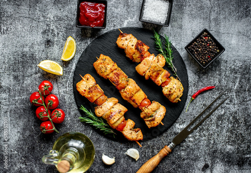 salmon kebab on skewers,grilled on a stone background.