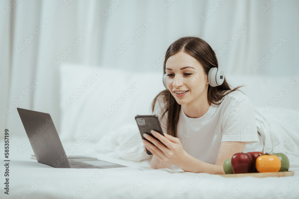 beautiful girl talking on the phone in bed Beautiful young woman doing herself on bed at home beautiful girl talking on the phone in bed Beautiful young woman doing herself on bed at home