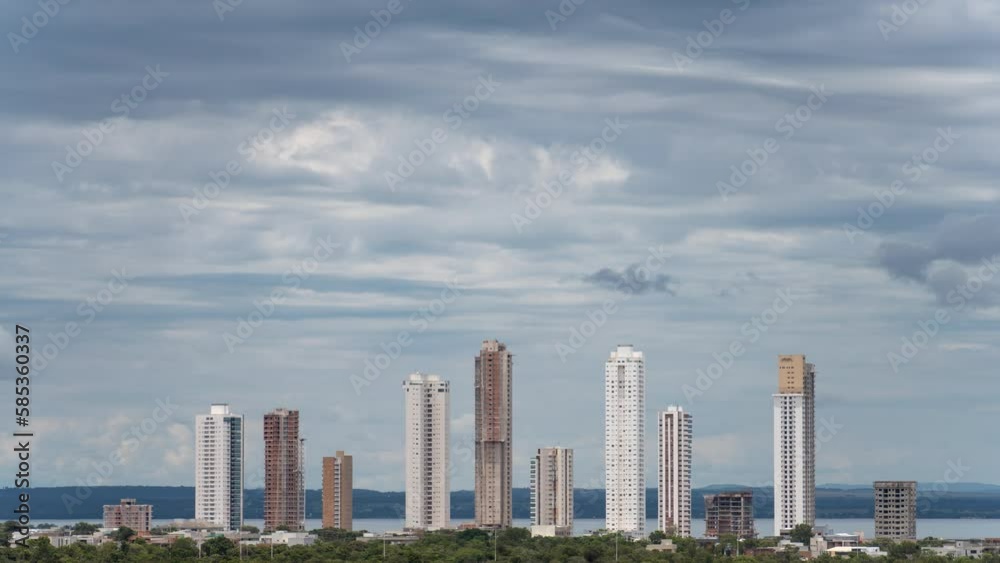 A Mesmerizing View of Towering Skyscrapers Framed by a Serene Lake A Mesmerizing View of Towering Skyscrapers Framed by a Serene Lake