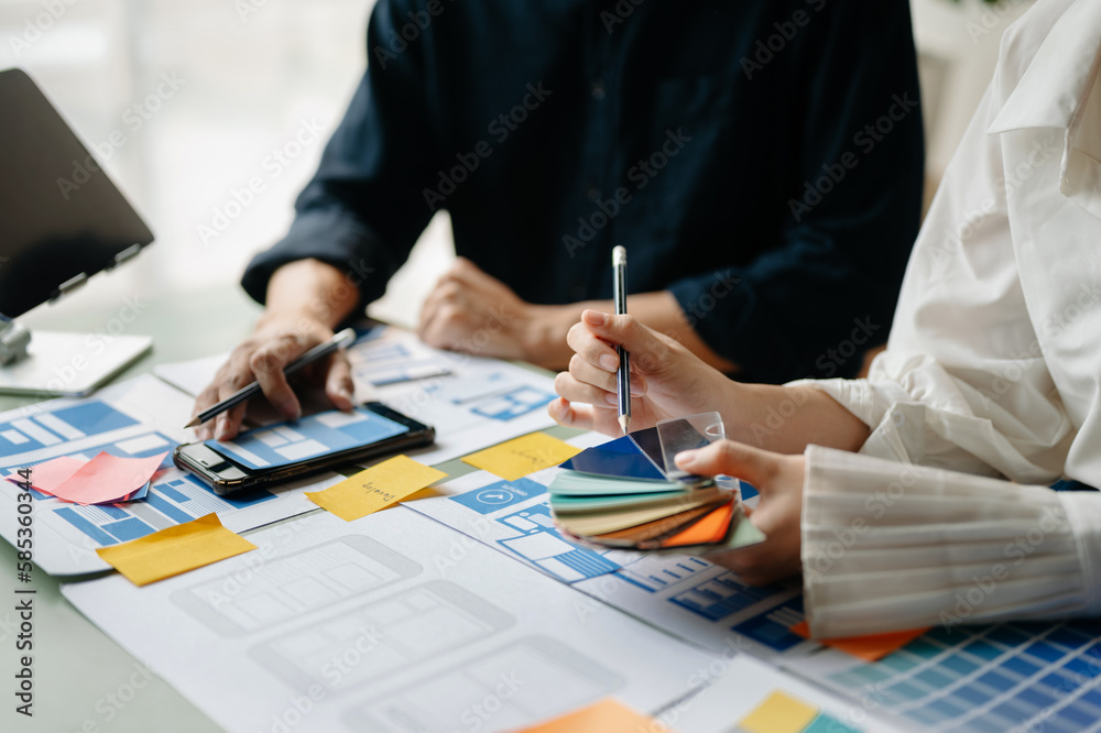© Nuttapong punna - Asian businessman and woman people meeting in office. Employee brainstorm and work as team, plan and discuss project by point on paper and tablet. © Nuttapong punna - Asian businessman and woman people meeting in office. Employee brainstorm and work as team, plan and discuss project by point on paper and tablet.