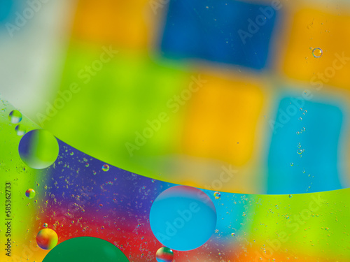 A colorful background with bubbles and water droplets. mulicolor backdrop and blurred with oil dropes. photo