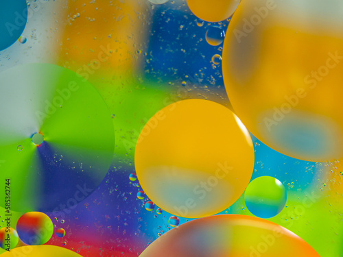 A colorful background with bubbles and water droplets. mulicolor backdrop and blurred with oil dropes.