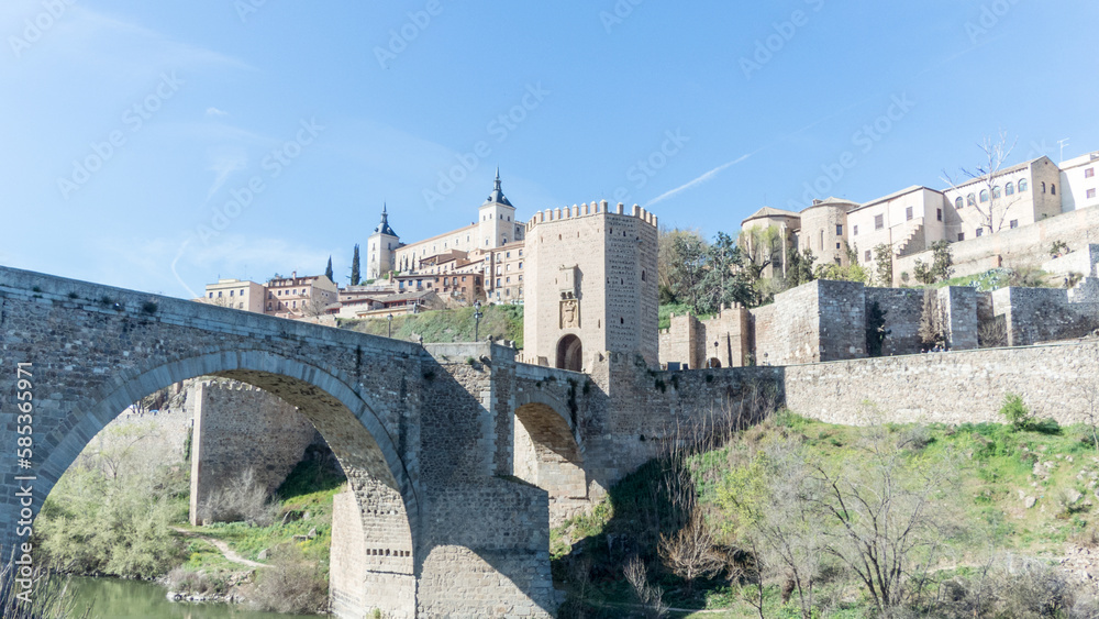 The Puente de Alcantara, a Roman arch bridge in Toledo, Catile-La Mancha, Spain, spanning the Tajo River.