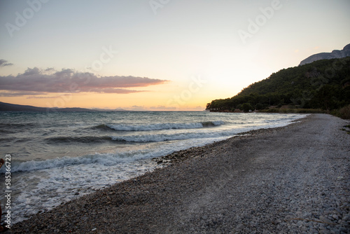 sunset over the sea on the beach and clouds