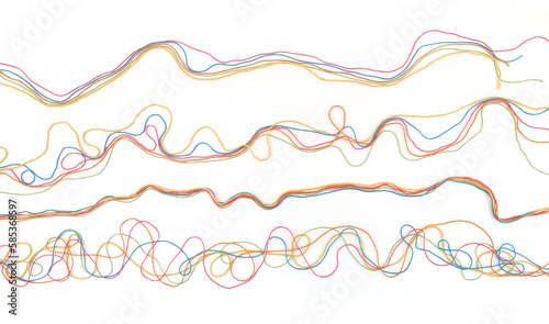 Fotografie Tangled colorful cotton threads isolated on white background