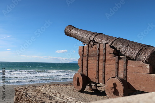 Ancient canon pointing over the mediterranean sea from Castillo de Sohail in Fuengirola on Spain's Costa del Sol