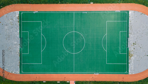 An empty soccer field with running tracks around it