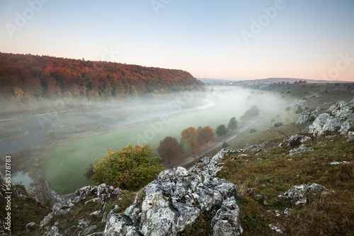 fog in the valley - mystical atmosphere in the Eselsburger Tal at sunrise in autumn. Herbrechtingen - Brenz River photo