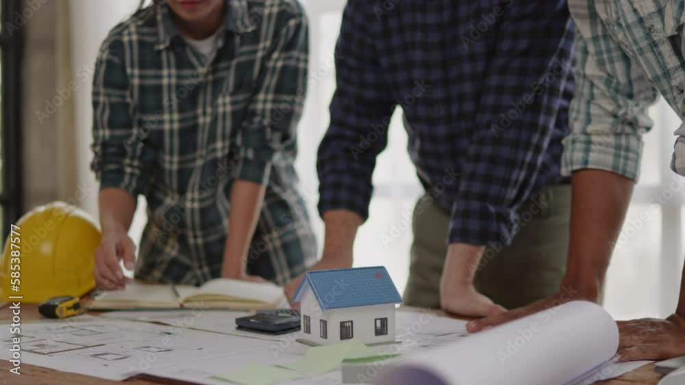 Closeup of hands engineer and architect team discussed about construction and architectural drawings works. Closeup of hands engineer and architect team discussed about construction and architectural drawings works.