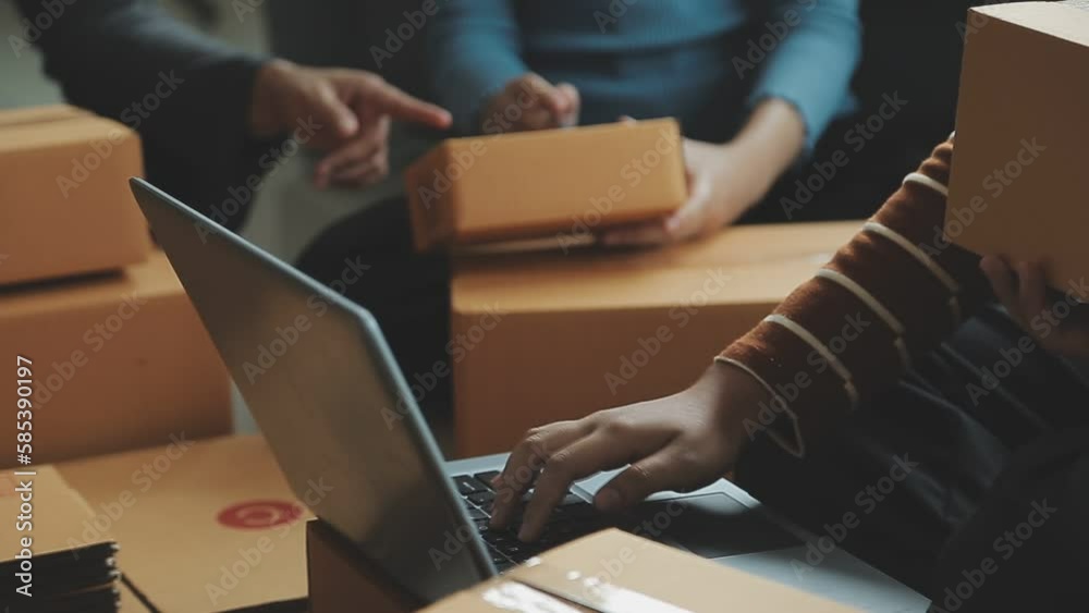 Entrepreneurs Small Business SME Independent men work at home Use smartphones and laptops for commercial checking, online marketing, packing boxes, SME sellers, concept, e-commerce team, online sales