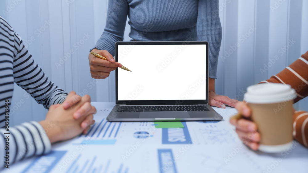Φωτογραφία White blank screen laptop for mock up, small business accounting team meeting three asian people with salary monthly charts data, basic business accounting and bookkeeping concept
