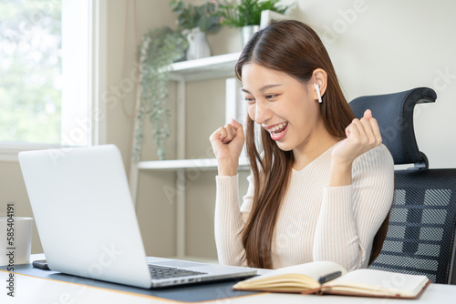 Success, happy asian young business woman wearing earphones, listen to test exam winner in class study of college, celebrate student online, read email or web via internet, triumph of get great job.