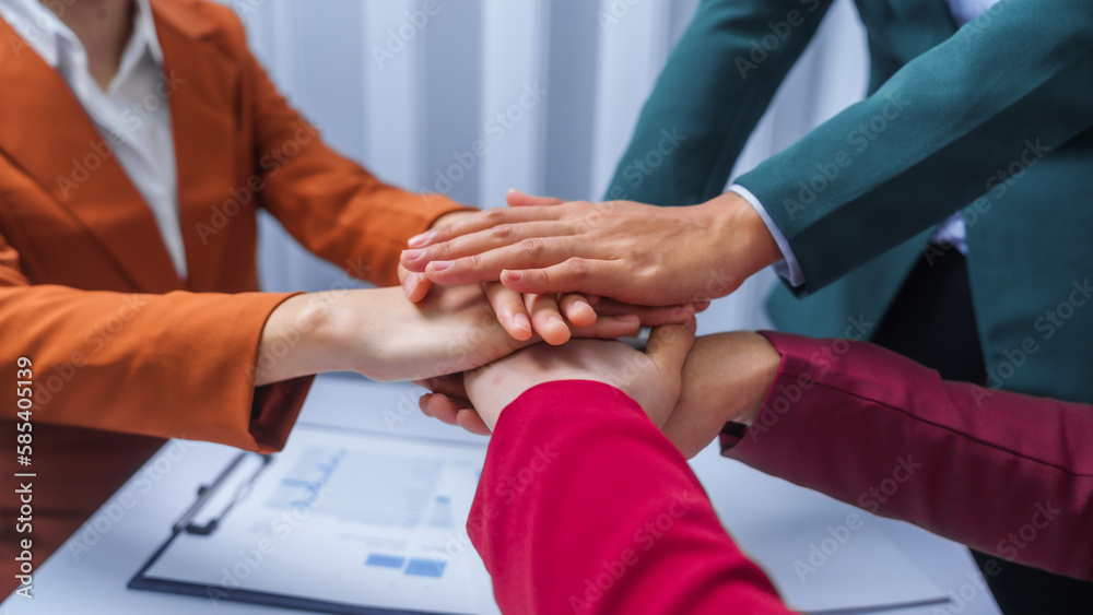 Fototapeta premium join hands teamwork concept. small business accounting team meeting three asian people with salary monthly charts data, basic business accounting and bookkeeping concept.