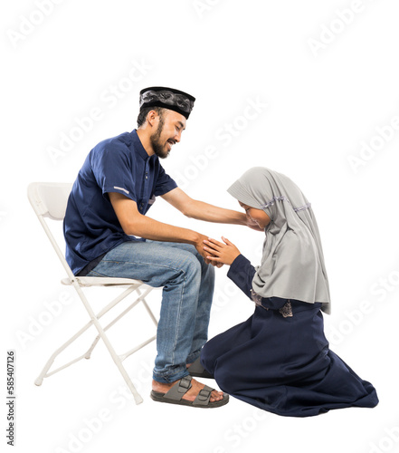 portrait of happy muslim daughter shake hand her father apologizing during eid mubarak over white background