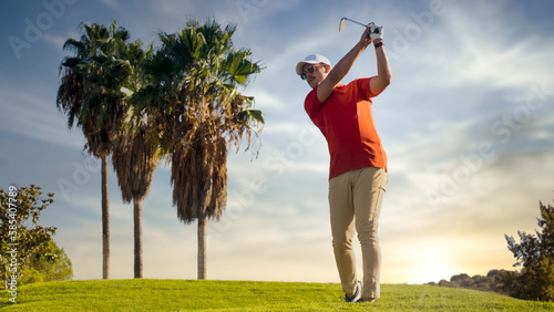 Golf shot man off the tee on a hole on the golf course. 