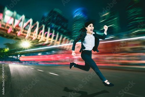 female entrepreneur running over motion blur background