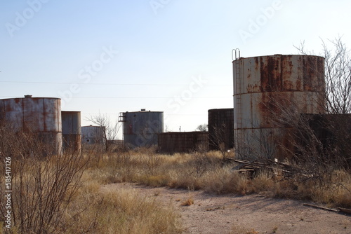 Old steel and wood crude oil storage tanks
