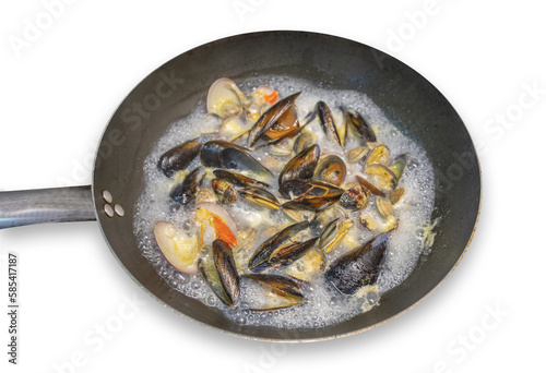 Cooking in a pan of clams, mussels and cockles