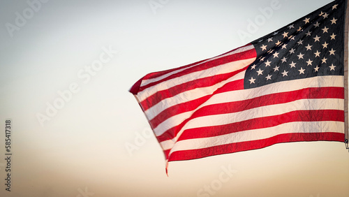 Independence Day, 4th of July, Memorial Day, Veterans Day, Labor Concept. American USA flag waving in the wind against sun flare overlay nature outdoor background, Slow Motion. Concept of Memorial Day
