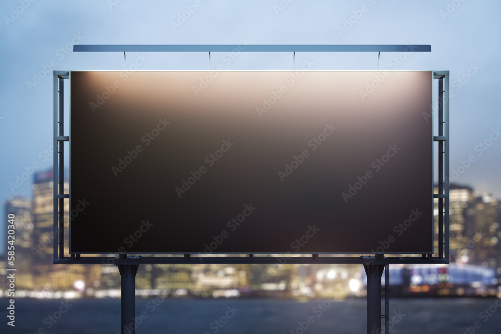 Obraz premium Blank black horizontal billboard on skyline background at evening, front view. Mock up, advertising concept