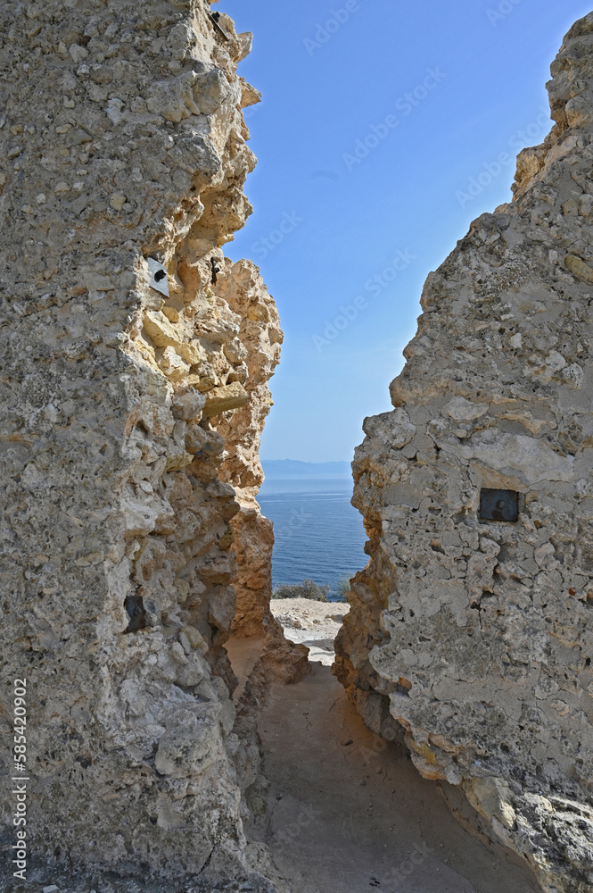 View through the ruin of the so called Torre del Poetto (Tower of the Poetto) on the Devils saddle, in Cagliari, Sardinia; view on the mediterranean ocean. 