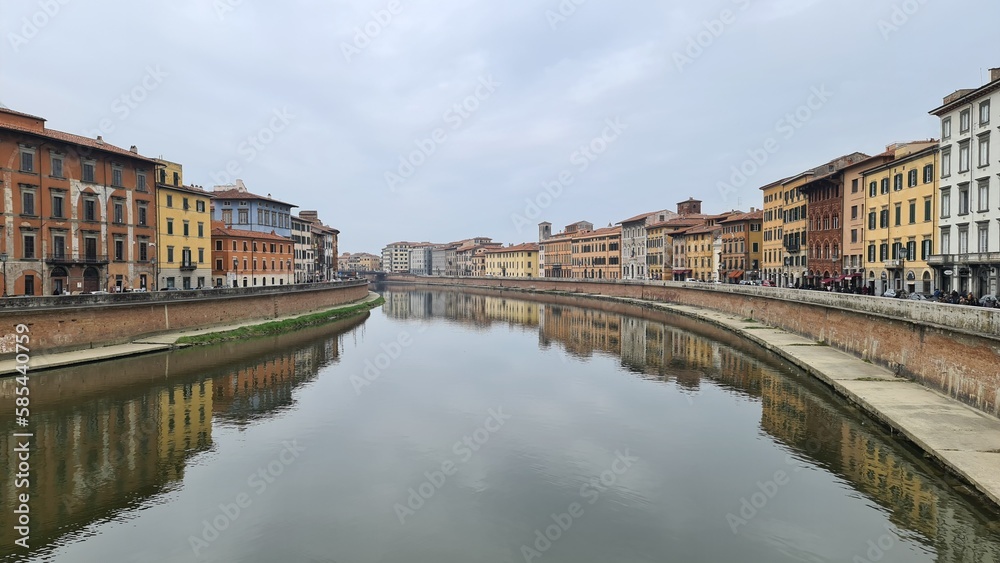 Pisa, Italy - February 25, 2023: View of the medieval town of Pisa from bridge 