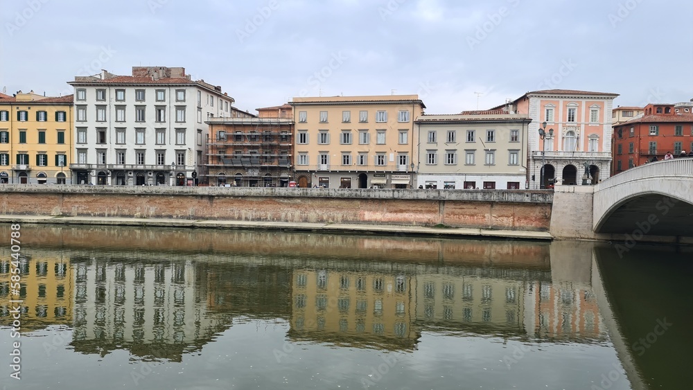Pisa, Italy - February 25, 2023: View of the medieval town of Pisa from bridge 