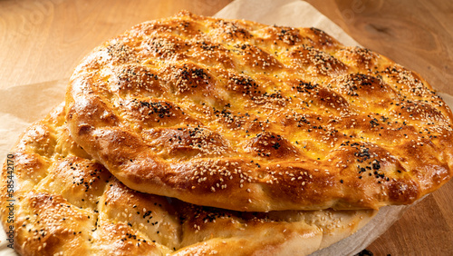 Close up of special Turkish Ramadan Pita pide bread on wooden table