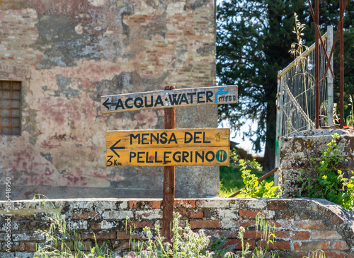 signposts showing pilgrims where to go through Italy on the Via Francigena road from San Miniato to Gambassi Terme Tuscany region, central Italy