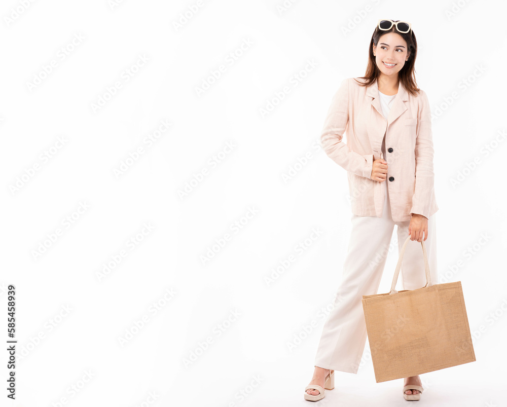 Young woman in suit and eyeglasses hold shopping bag with confident isolated on white background studio portrait Shopping discount sale Young Business lady look at camera with happy Full body Young woman in suit and eyeglasses hold shopping bag with confident isolated on white background studio portrait Shopping discount sale Young Business lady look at camera with happy Full body