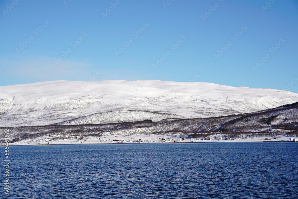 snowy weather and mountains in tromso fjords