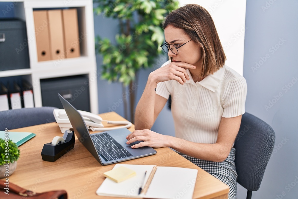 Young beautiful hispanic woman business worker using laptop working at office