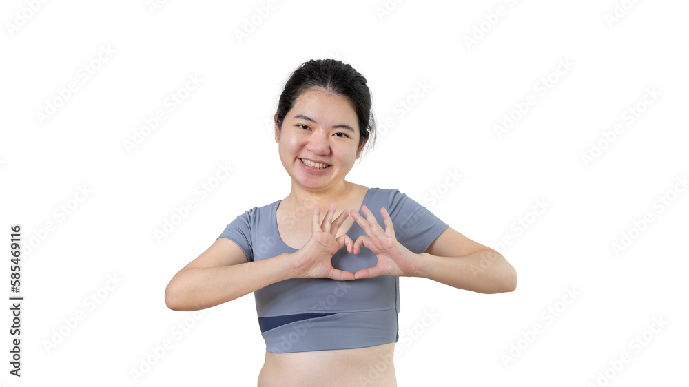Asian young woman with bright smile making heart symbol shape with hands, Symbol of love and romance, Give each other cuteness and create smiles for each other, Positive thinking concept. Asian young woman with bright smile making heart symbol shape with hands, Symbol of love and romance, Give each other cuteness and create smiles for each other, Positive thinking concept.
