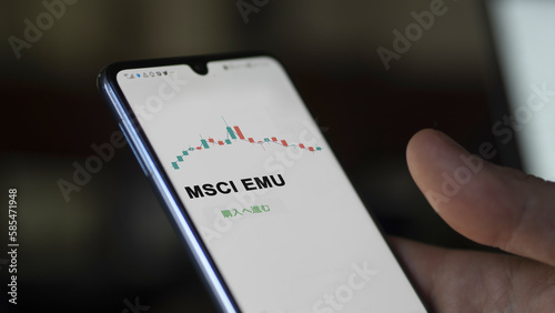 Investor analyzing an ETF. Funds stocks exchange ETFs Japanese text: msci emu, buy. MSCI EMU 証券取引所 投資 shares