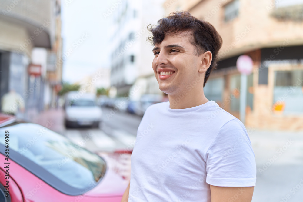 Non binary man smiling confident looking to the side at street Non binary man smiling confident looking to the side at street